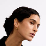 La-Dailie-earrings-gold-domed-hoop-earrings
