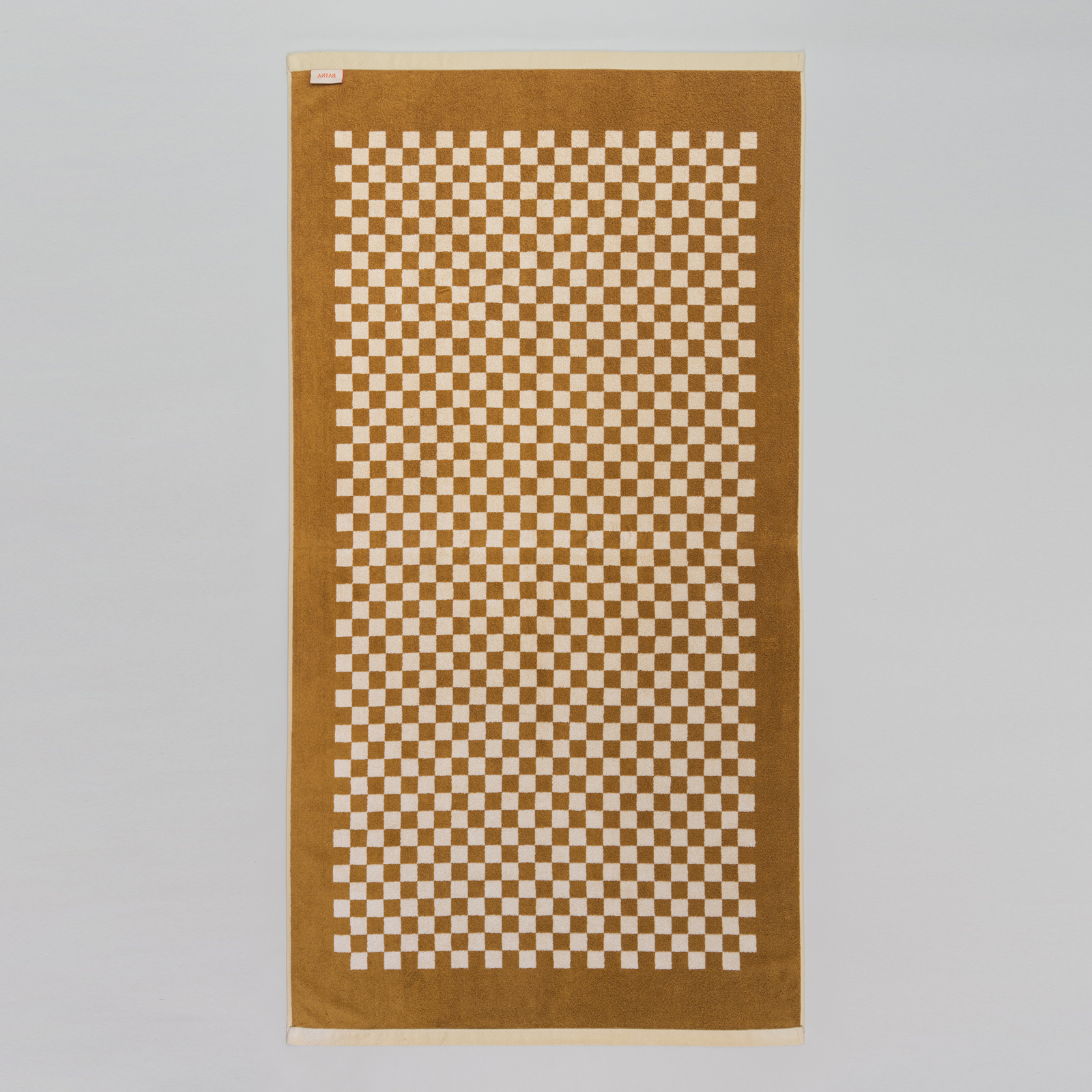 BAINA-Checkered-Towel-Roman-Pool_Towel_Cedar-Sand-Reverse